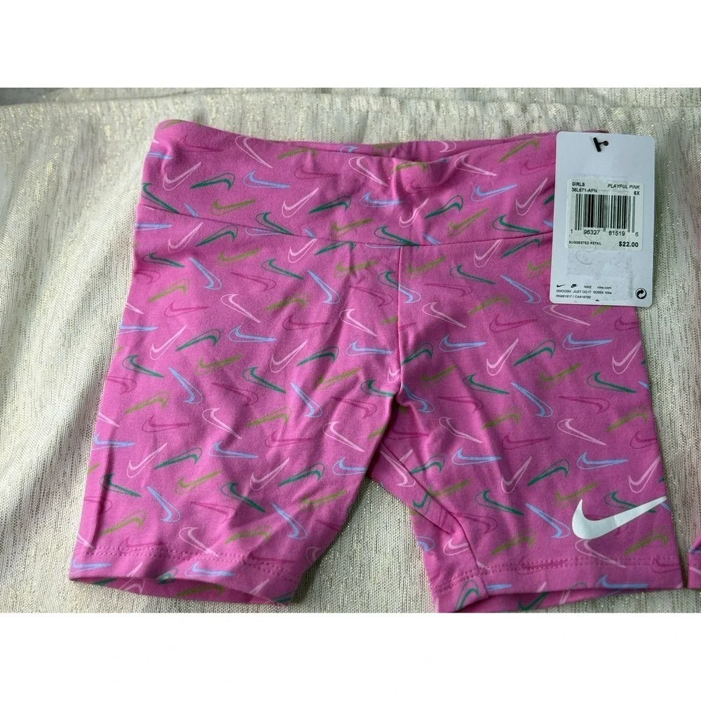 Three pairs of pink Nike biker shorts, size 6X and 6